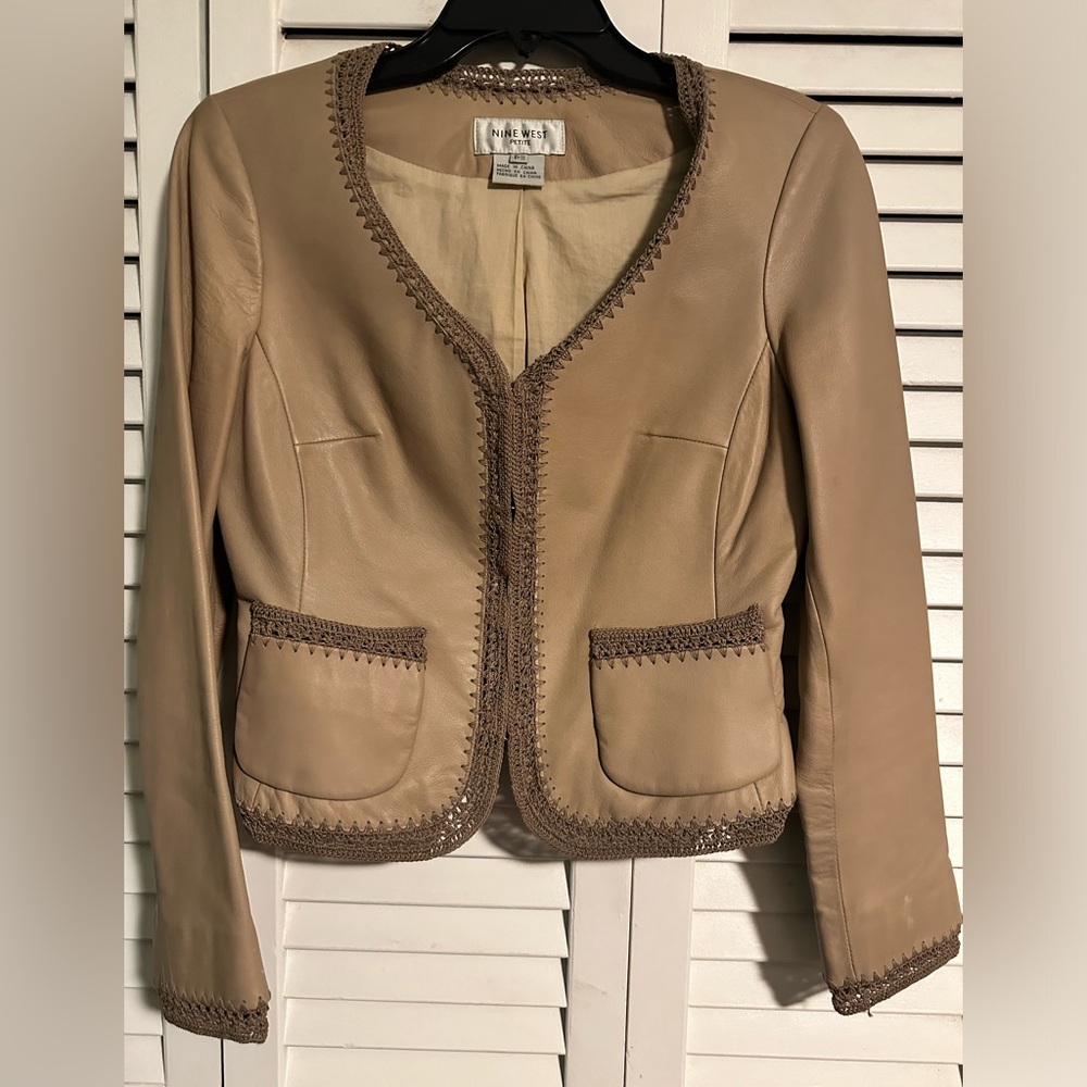 Leather jacket with crochet trim and pockets